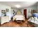 Well-lit main bedroom featuring hardwood floors, vintage furniture, and ample natural light at 7514 Secrest Shortcut Rd, Indian Trail, NC 28079
