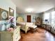 Elegant main bedroom with hardwood floors, complemented by an ornate bed frame at 7514 Secrest Shortcut Rd, Indian Trail, NC 28079