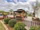 Inviting outdoor patio featuring gazebo, pool and beautiful landscaping for ultimate relaxation and enjoyment at 7514 Secrest Shortcut Rd, Indian Trail, NC 28079