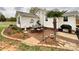 Charming patio with dining set, outdoor grill, and lush landscaping, perfect for alfresco dining and relaxation at 7514 Secrest Shortcut Rd, Indian Trail, NC 28079