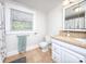 Bathroom featuring window with blinds, toilet, sink with vanity, tile floor and matching countertop at 848 Woodland Rd, Statesville, NC 28677