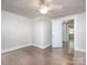 Bright bedroom with hardwood flooring, ceiling fan, doorway leading to other rooms, base trim and neutral walls at 848 Woodland Rd, Statesville, NC 28677