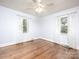 Well-lit bedroom featuring a ceiling fan and natural light through large windows at 848 Woodland Rd, Statesville, NC 28677