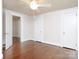 Bright bedroom featuring hardwood floors, neutral walls, and a ceiling fan at 848 Woodland Rd, Statesville, NC 28677