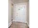 Bright entryway featuring hardwood floors and a decorative front door at 848 Woodland Rd, Statesville, NC 28677