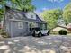 Gray brick home with a white car parked in the driveway at 848 Woodland Rd, Statesville, NC 28677