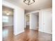 Hallway with hardwood floors and access to a bedroom and a laundry room at 848 Woodland Rd, Statesville, NC 28677