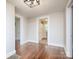 Hallway with hardwood floors and access to a bathroom and bedroom at 848 Woodland Rd, Statesville, NC 28677