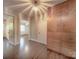 Hallway with hardwood floors and built-in storage with access to two bedrooms at 848 Woodland Rd, Statesville, NC 28677