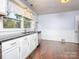 Bright kitchen featuring stainless steel appliances, white cabinets, and modern fixtures at 848 Woodland Rd, Statesville, NC 28677