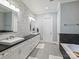 Bathroom features double sinks, a soaking tub, tile floor, and a separate shower at 8912 Heydon Hall Cir, Charlotte, NC 28210