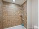 Bathroom with white tiled shower and tub at 8912 Heydon Hall Cir, Charlotte, NC 28210