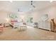 Bright bedroom with decor, a ceiling fan, neutral carpet and trim, plus a window at 8912 Heydon Hall Cir, Charlotte, NC 28210
