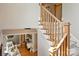 Grand foyer with staircase overlooking the living room with hardwood floors and decorative fireplace at 8912 Heydon Hall Cir, Charlotte, NC 28210