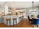 Bright kitchen boasts an island with bar seating, stainless steel appliances, and modern finishes at 8912 Heydon Hall Cir, Charlotte, NC 28210