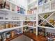 Walk-in pantry with custom shelving, providing ample storage for groceries, supplies, and wine at 8912 Heydon Hall Cir, Charlotte, NC 28210