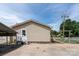 Back of the house featuring a carport and a backyard enclosed with a chainlink fence at 907 Bethpage Rd, Kannapolis, NC 28081