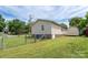 Side view of a home featuring a fenced yard and a small storage shed in the backyard at 907 Bethpage Rd, Kannapolis, NC 28081