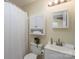 Cozy bathroom featuring a toilet, vanity with a mirror, and a shower with white curtain at 907 Bethpage Rd, Kannapolis, NC 28081