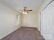Bedroom featuring neutral walls, plush brown carpet, ceiling fan, and a window with natural light at 907 Bethpage Rd, Kannapolis, NC 28081