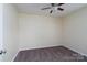 Cozy bedroom with ceiling fan and neutral carpet offers a serene and comfortable space at 907 Bethpage Rd, Kannapolis, NC 28081