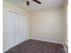 Carpeted bedroom provides a closet and a window for natural lighting at 907 Bethpage Rd, Kannapolis, NC 28081