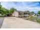 Charming home featuring a covered porch, a spacious driveway, and a fenced front yard at 907 Bethpage Rd, Kannapolis, NC 28081
