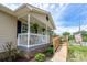 Charming home with ramp, inviting porch, and manicured landscaping creates a welcoming atmosphere at 907 Bethpage Rd, Kannapolis, NC 28081