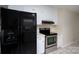 Functional kitchen features sleek appliances, white cabinets, and seamless integration with living space at 907 Bethpage Rd, Kannapolis, NC 28081