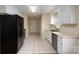 Bright kitchen with white cabinets and modern appliances, designed for efficiency and style at 907 Bethpage Rd, Kannapolis, NC 28081