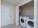Bright laundry room featuring an included washer, dryer, and water heater at 907 Bethpage Rd, Kannapolis, NC 28081