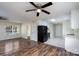 Open-concept living room and kitchen with a ceiling fan and hardwood floors; bright and inviting at 907 Bethpage Rd, Kannapolis, NC 28081