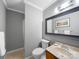 Neutral bathroom featuring a classic vanity and tiled shower, creating a clean and functional space at 925 Lanier Ln, Monroe, NC 28110