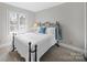 Bedroom with plantation shutters, carpet flooring, and simple decor at 925 Lanier Ln, Monroe, NC 28110