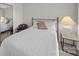 Bedroom featuring white bedding, carpet flooring, and minimalist decor at 925 Lanier Ln, Monroe, NC 28110