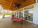 Outdoor deck featuring comfortable lounge chairs, perfect for relaxing and enjoying serene water views at 925 Lanier Ln, Monroe, NC 28110