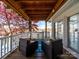 Inviting covered deck featuring comfortable seating, perfect for relaxing and enjoying peaceful lake views at 925 Lanier Ln, Monroe, NC 28110