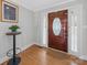 Welcoming foyer featuring hardwood floors, stylish decor, and natural light, creating a warm entry at 925 Lanier Ln, Monroe, NC 28110