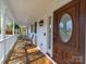 Inviting covered front porch with rocking chairs, perfect for relaxing and enjoying the outdoors at 925 Lanier Ln, Monroe, NC 28110