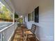 Inviting covered front porch with rocking chairs, perfect for relaxing and enjoying the outdoors at 925 Lanier Ln, Monroe, NC 28110