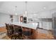 Modern kitchen with a large island, stainless steel appliances, and custom cabinetry, perfect for cooking at 925 Lanier Ln, Monroe, NC 28110