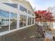 Spacious rear deck with rocking chairs, overlooking a serene lake at 925 Lanier Ln, Monroe, NC 28110