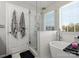 Bright bathroom featuring a glass shower, soaking tub, and modern fixtures at 10107 Atkins Ridge Dr, Charlotte, NC 28213