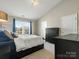 Bedroom featuring vaulted ceilings, carpeted floors, and contemporary furnishings at 10107 Atkins Ridge Dr, Charlotte, NC 28213