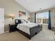 Bedroom featuring vaulted ceilings, carpeted floors, and contemporary furnishings at 10107 Atkins Ridge Dr, Charlotte, NC 28213
