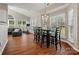 Bright dining area filled with light from many large windows overlooking the backyard at 10107 Atkins Ridge Dr, Charlotte, NC 28213
