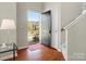 Inviting foyer with hardwood floors, a stylish door, and an open view to the outside at 10107 Atkins Ridge Dr, Charlotte, NC 28213