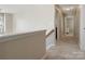 Hallway with carpeted floors, neutral walls and white trim creating a clean modern look at 10107 Atkins Ridge Dr, Charlotte, NC 28213