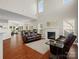 Spacious living room featuring a fireplace, high ceilings, and plenty of natural light at 10107 Atkins Ridge Dr, Charlotte, NC 28213