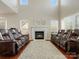 Bright living room with a fireplace and large windows providing lots of natural light at 10107 Atkins Ridge Dr, Charlotte, NC 28213